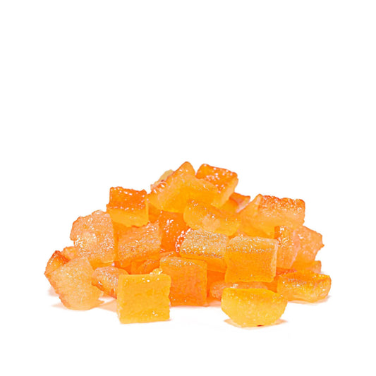 Pile of cubed candied orange peel on a white background