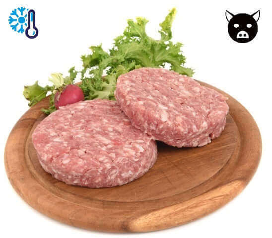 Two raw pork burger patties on a wooden plate with fresh green lettuce and a radish, featuring icons for refrigeration and pork.